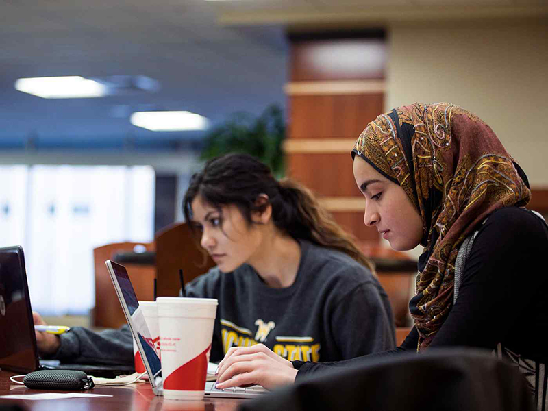 Two students study in the Rhatigan Student Center