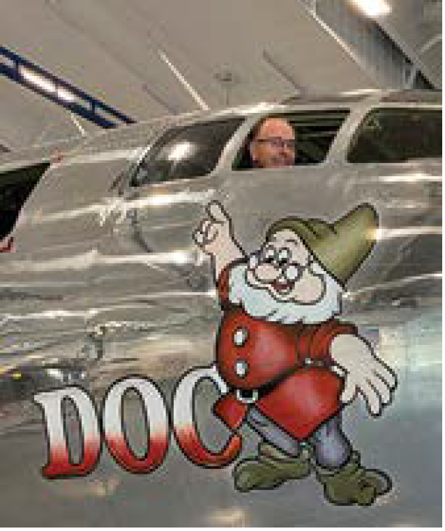 Photo of Larry Papenfuss in the cockpit of "Doc."