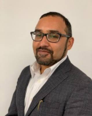 headshot of man smiling