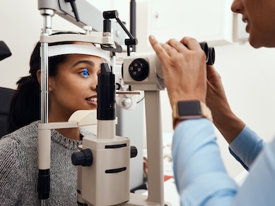 Optometry patient looking through prescription testing lenses