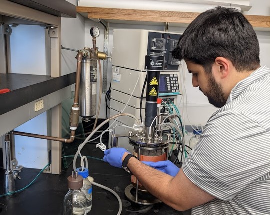 Graduate student preparing for an instrument run