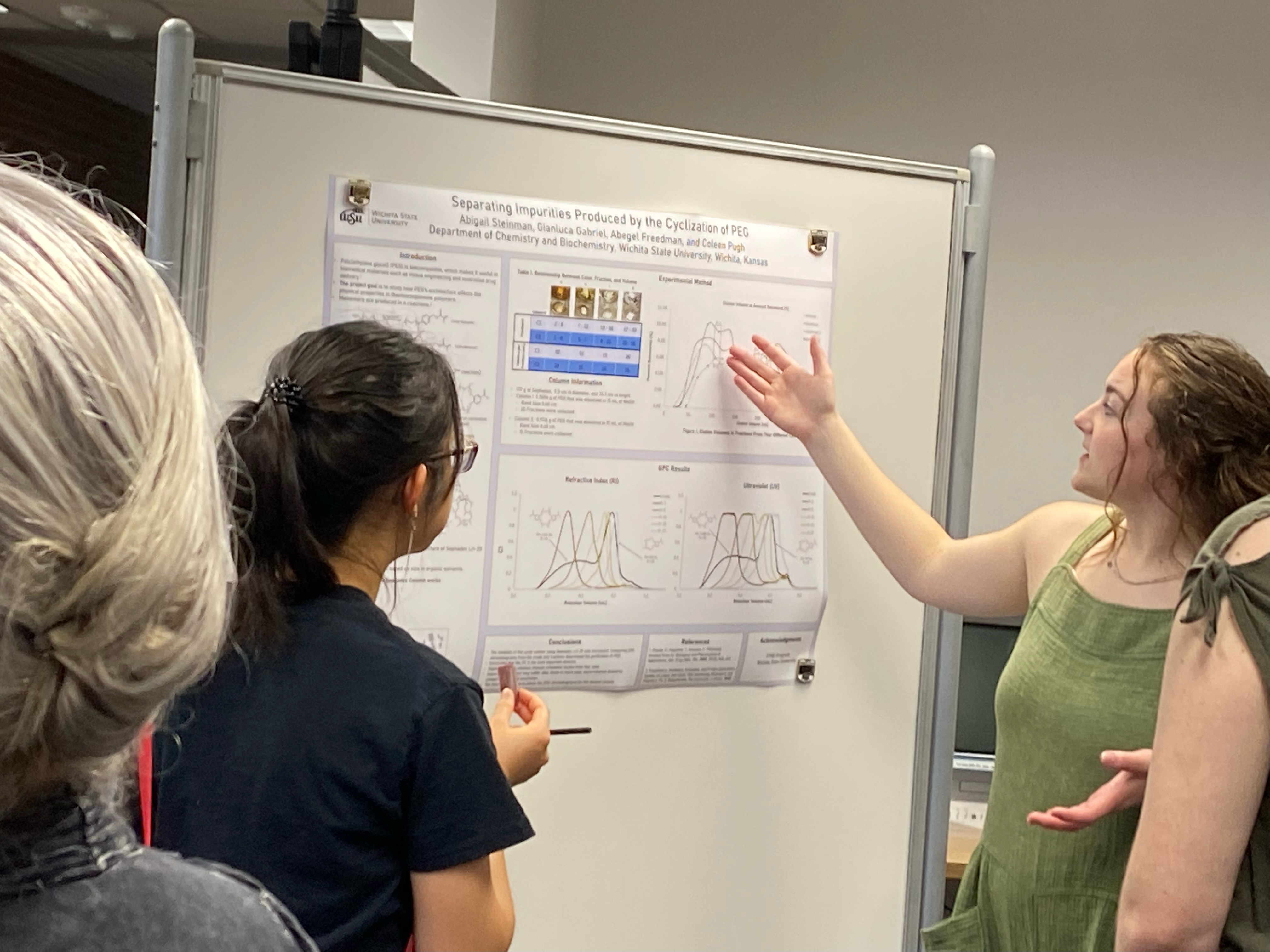 Undergraduate student presenting a poster at a conference