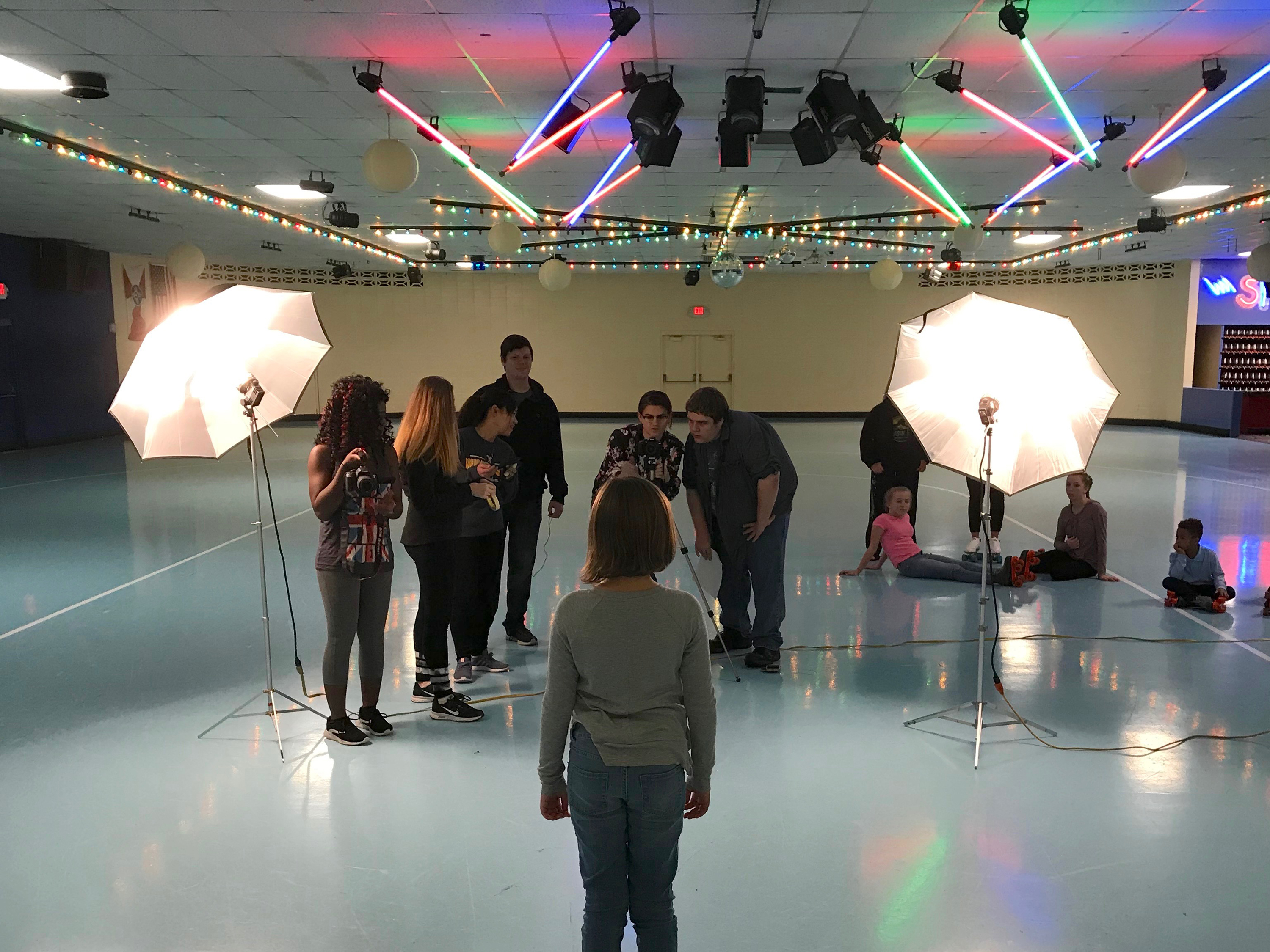 Shocker Ad lab students shoot video at a local roller skating rink