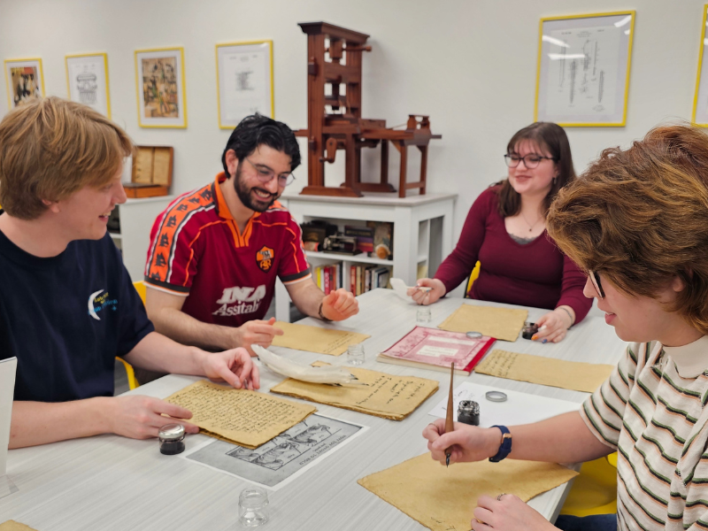 WSU students pratice manuscript writing with quills