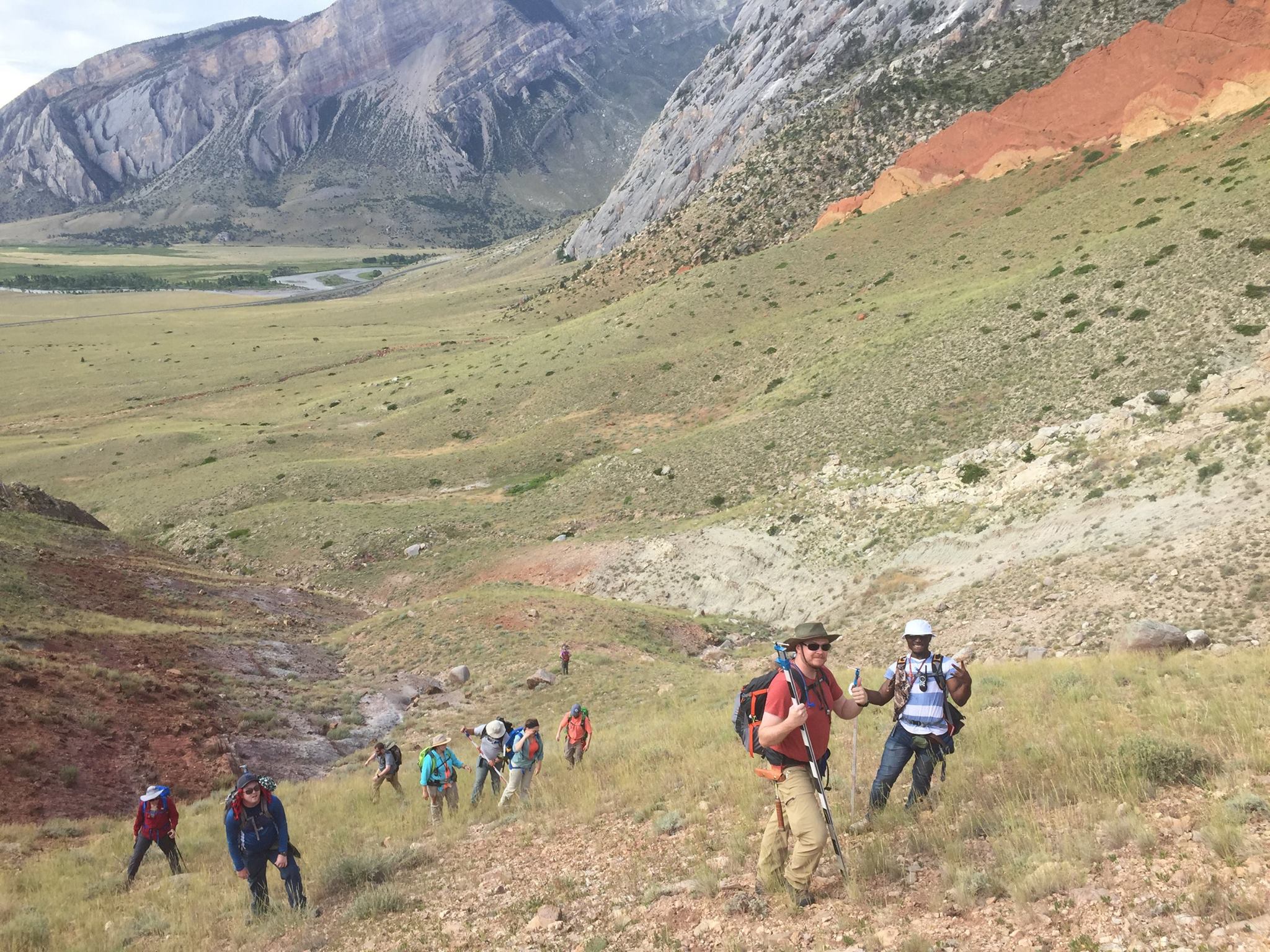 Geology field camp students give the thumbs up while on a hike