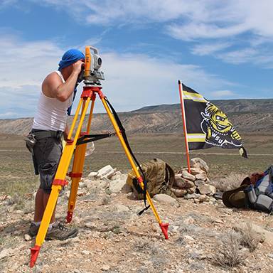 Student surveyor on location