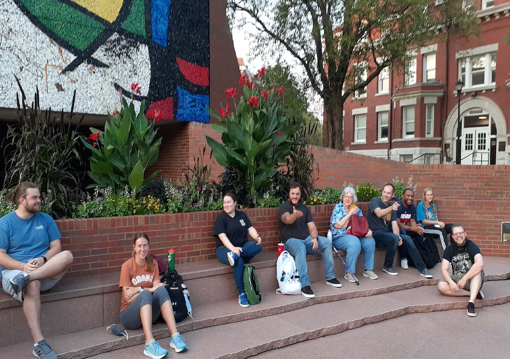 Photo of Dr. Price's class sitting in front of Ulrich Museum of Art for a seminar. 
