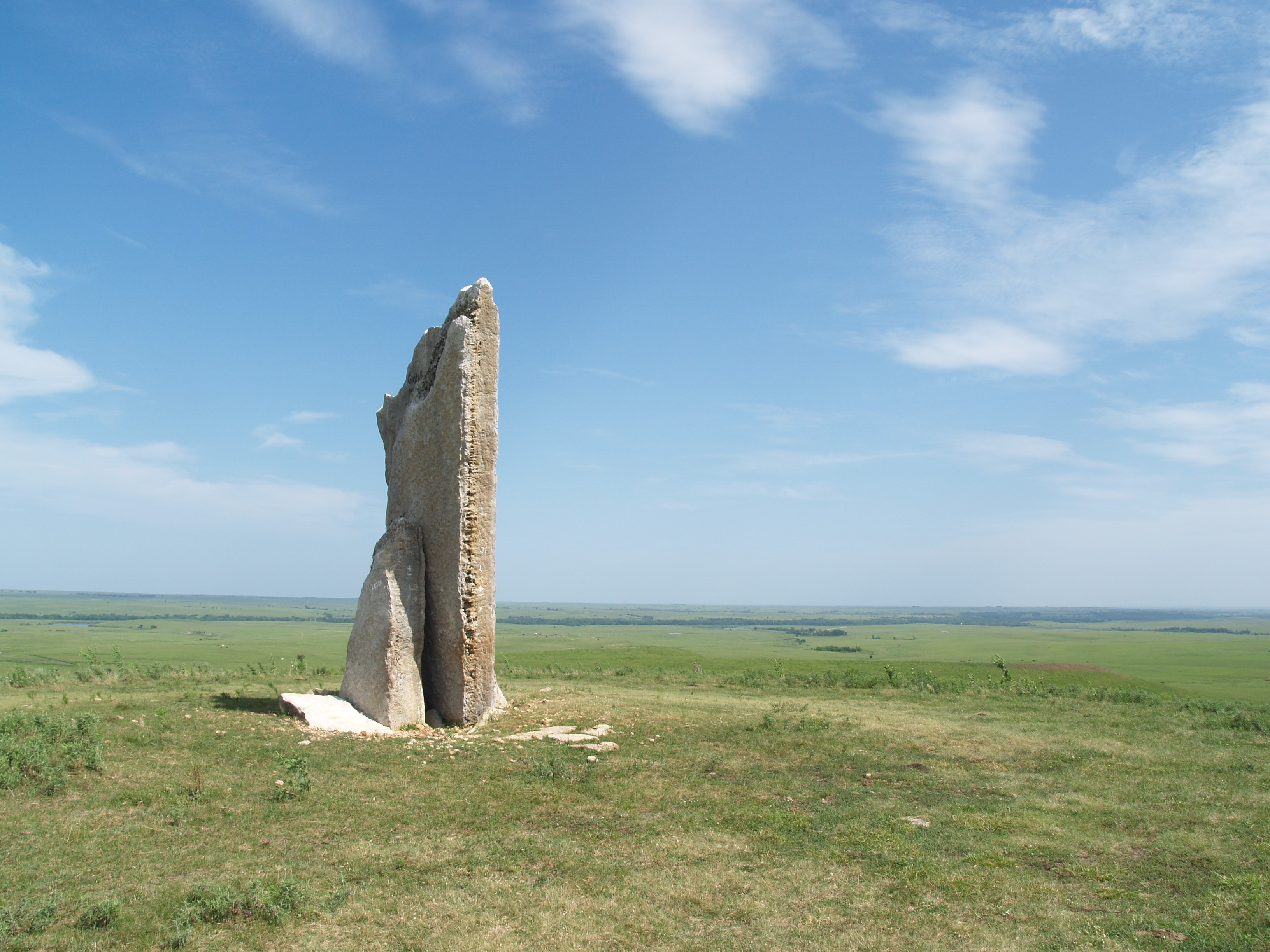 Image of stone on a broad plain with clear sky overhead