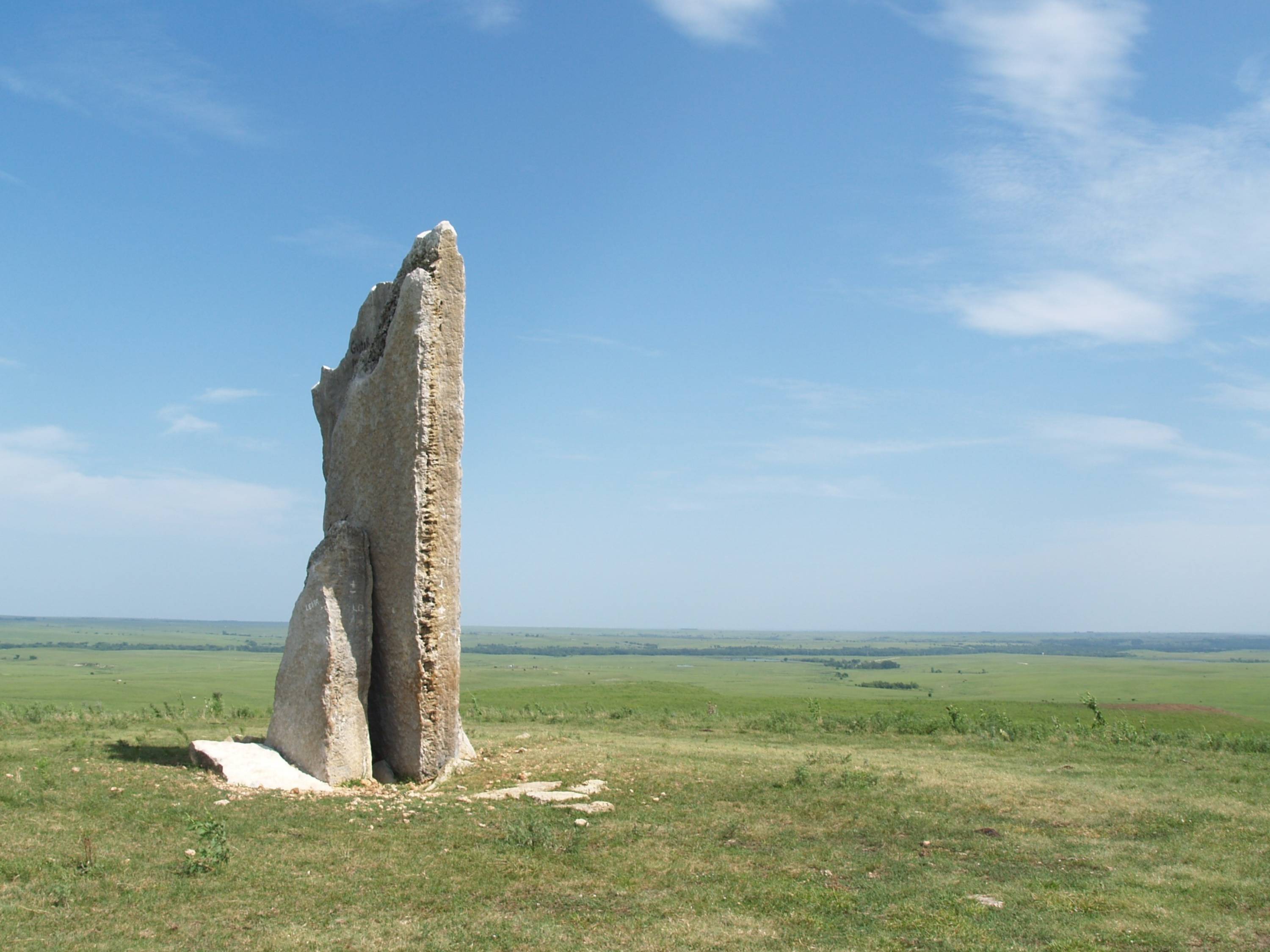 Image of stone on a broad plain with clear sky overhead