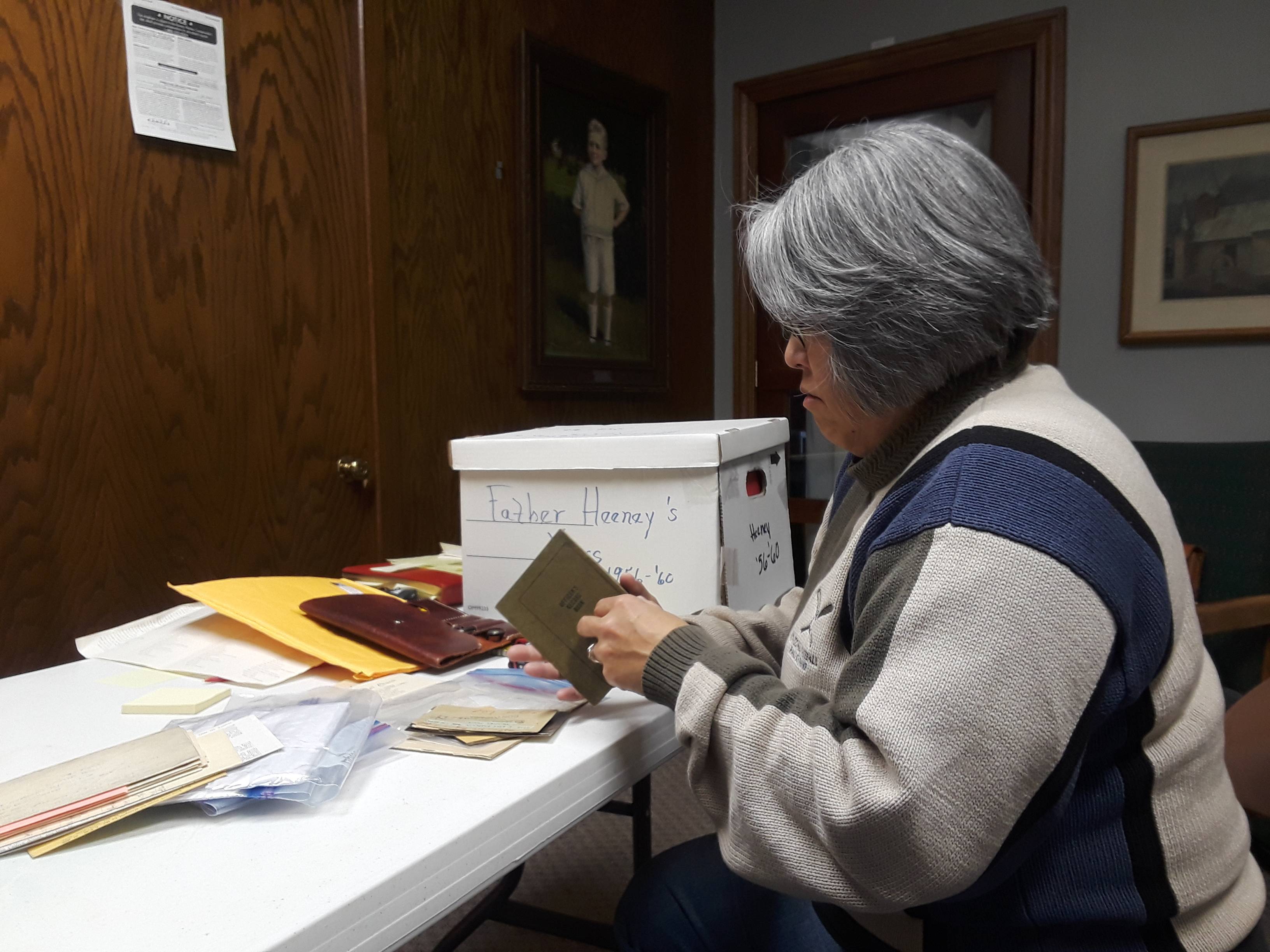 Sandra Reddish looks at documents