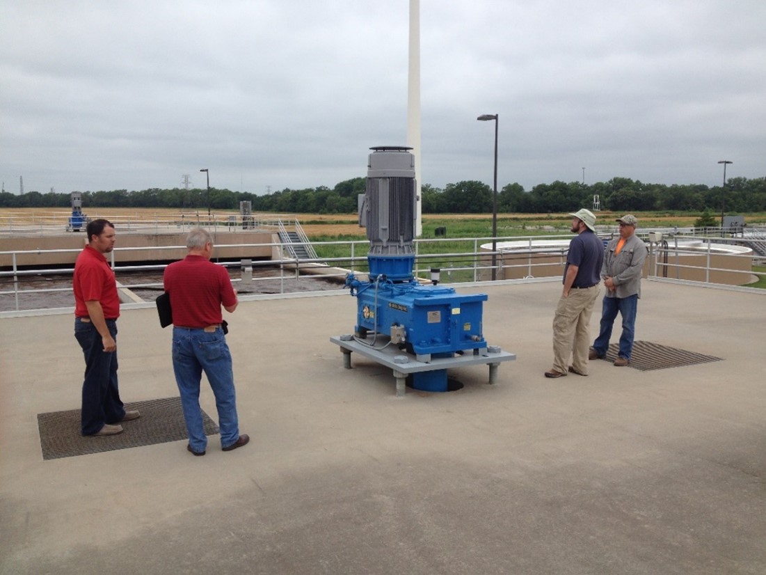 EFC WSU program managers visit with water utility staff during an on-site technical assistance visit.