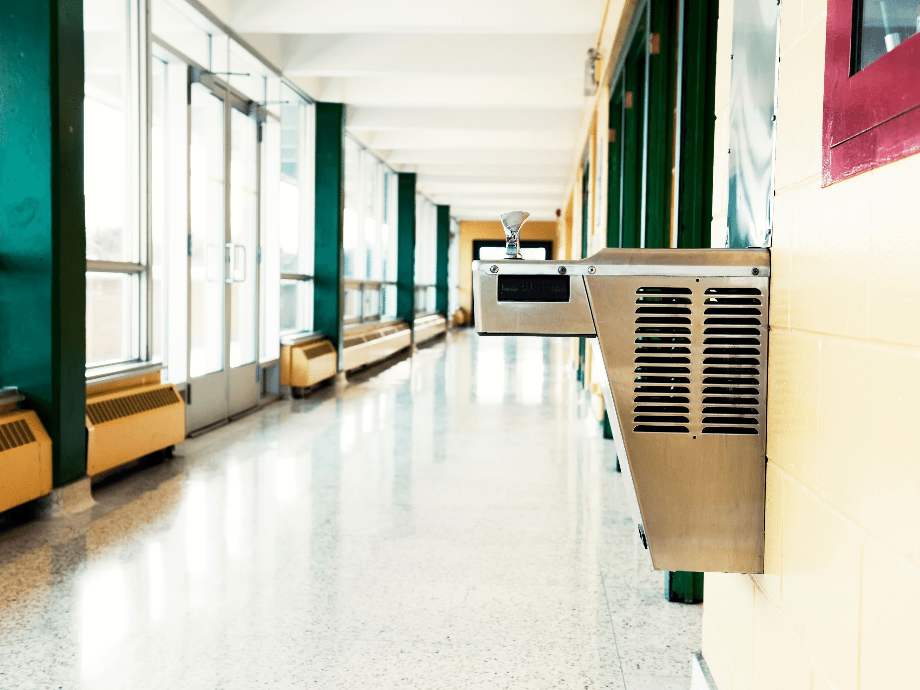 drinking fountain in school hallway