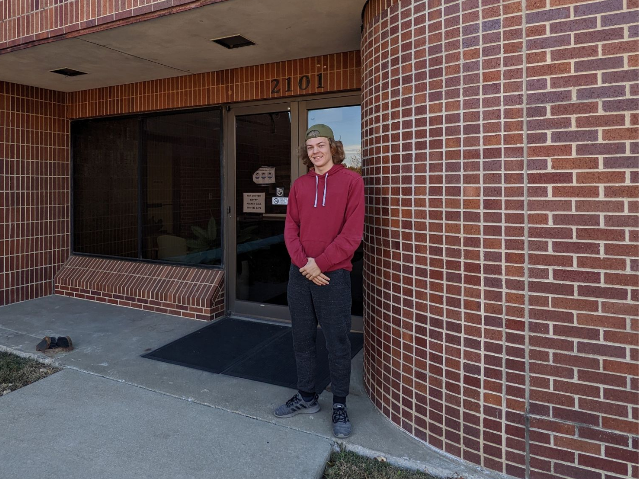 Adam Schnurr stands in front of treatment plant