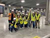 students in hardhats touring water treatment plant