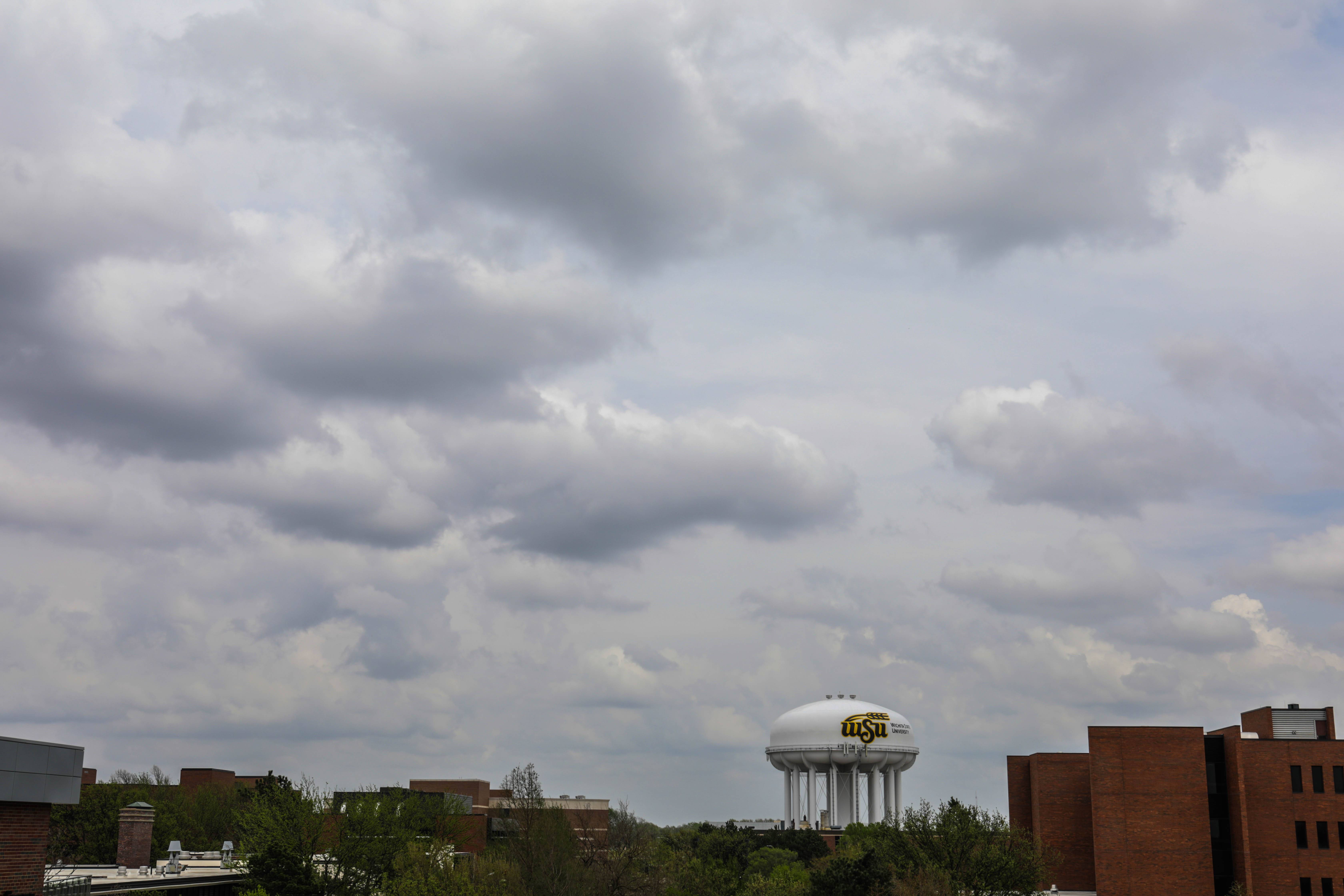 Image of a cloudy sky with a water tower. No pertinent information included.