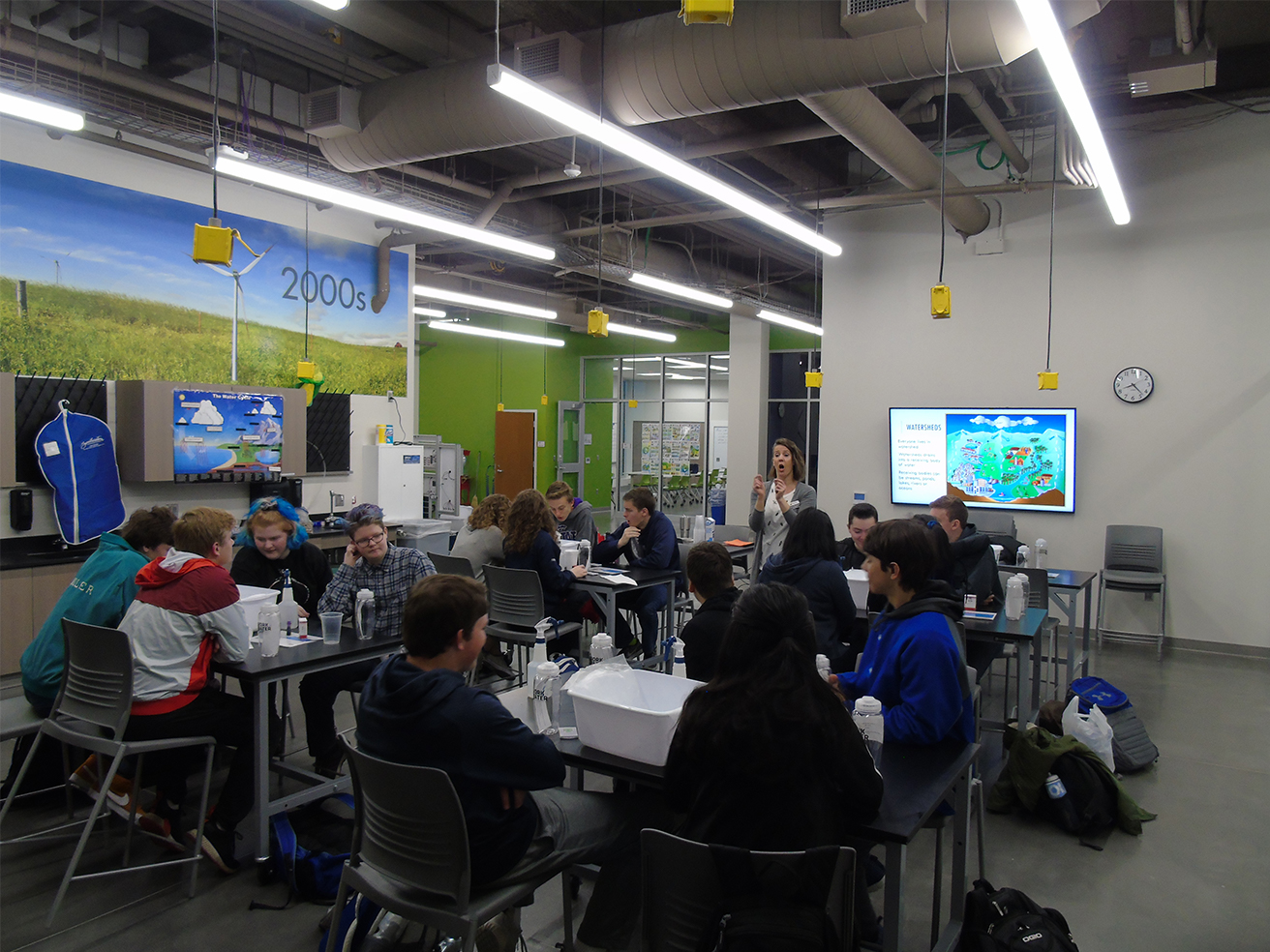 Photo of high school students at a work in water field trip