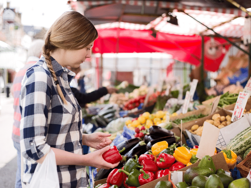 woman shopping at farmers market