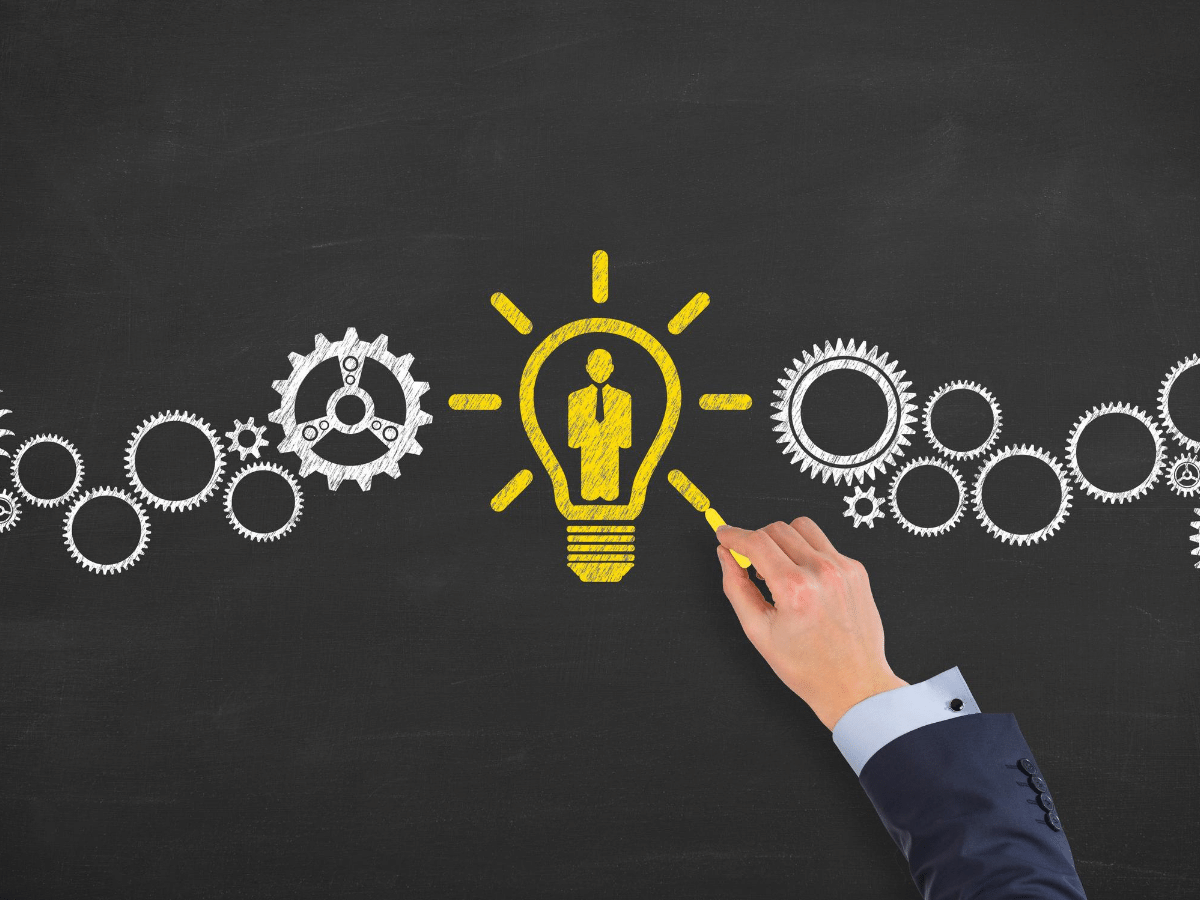 photo of book laying open on grass on sunny day