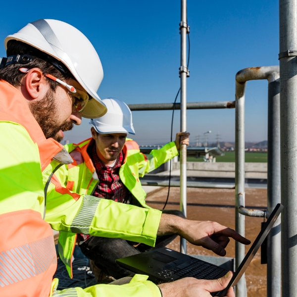 wastewater utility staff inspect plant infrastructure