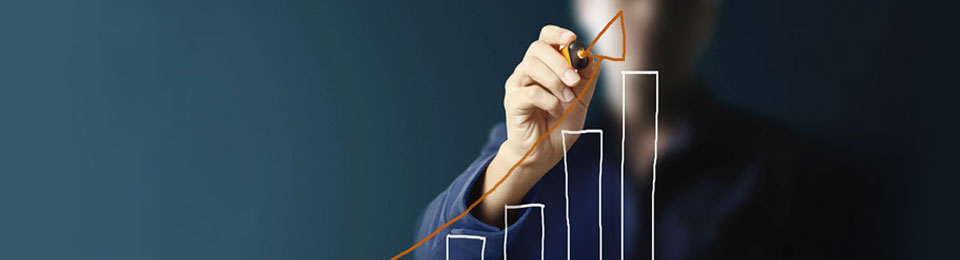 Photo of person drawing a bar graph on a wipeboard. 