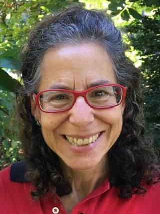 Smiling woman with glasses and red shirt