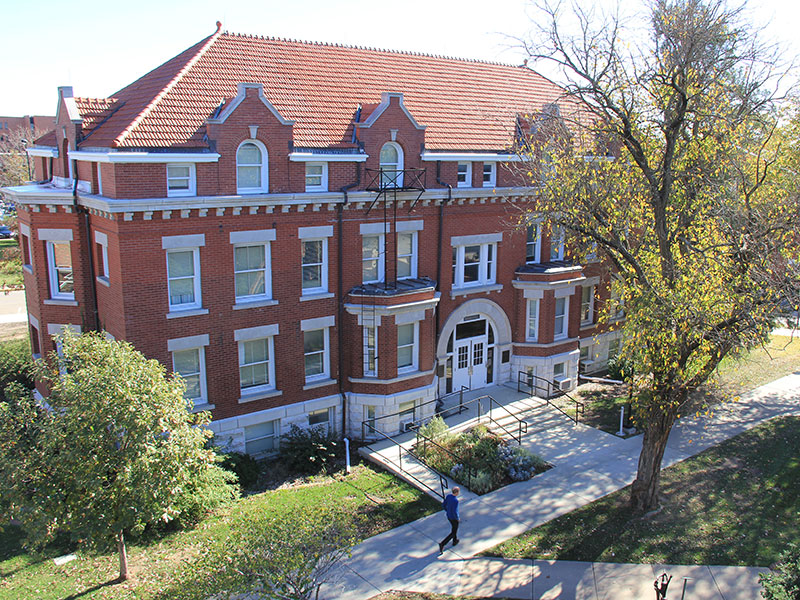 Photo of Fiske Hall, a three-sotry red brick building