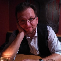 Dr. Bondy smiling in a casual pose