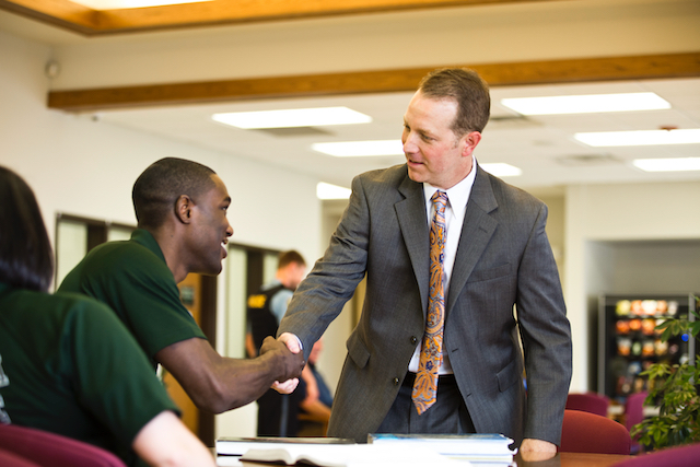 two men shaking hands