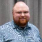 Andrew Hatch holding award