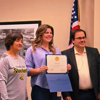 Sarah Smith receiving the Outstanding Graduate Student Award