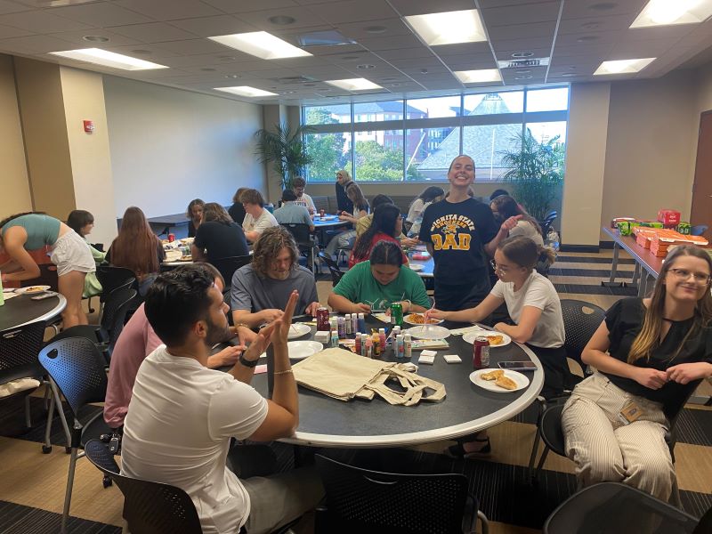 Psychology graduate student organization hosts mindfulness night with pizza and painting.