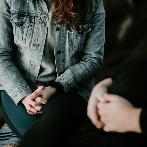 two individuals talking