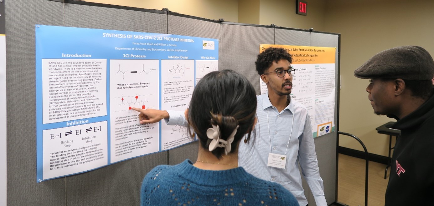 three students discussing chart