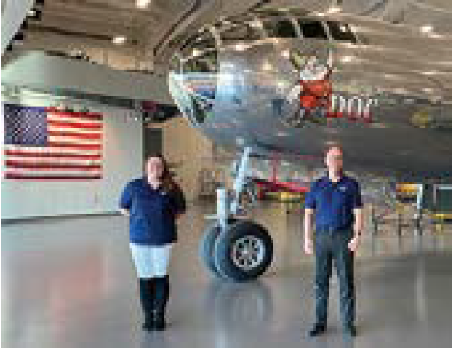 Photo of Cheyenne Stillinger and Larry Papenfuss in front of "Doc."