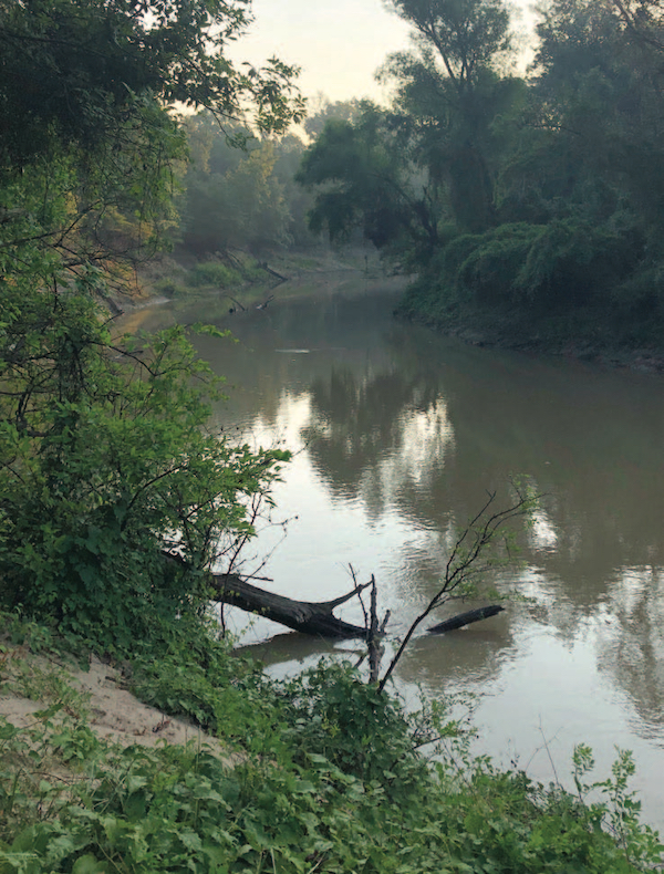 Photo: The Caddos lived along the Sabine River. The natural spring for which the site is named (Boxed Springs) is below the terrace, close to the river.