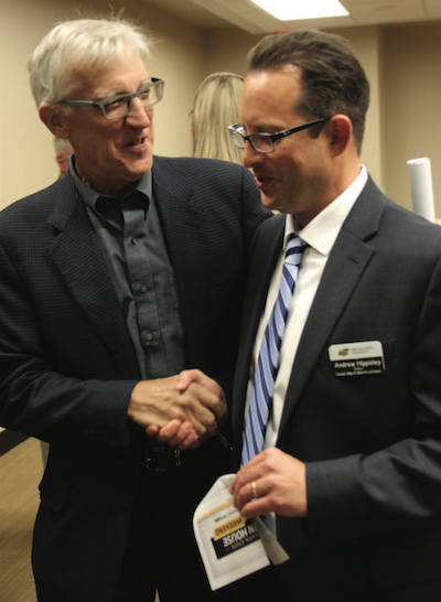 Photo: Mike James, alumnus and chair of the Fairmount College Advisory Committee, visits with Andrew Hippisley.