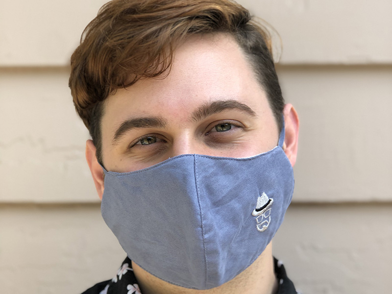 Photo portrait of Carter Bryant wearing a face mask