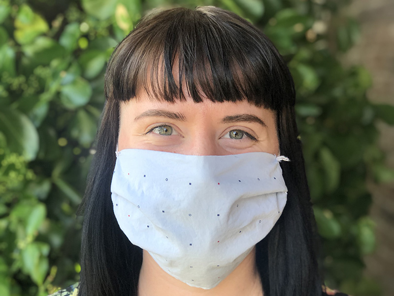 Photo portrait of Lydia Humphreys wearing a cloth face mask