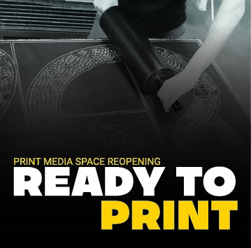 Ready to Print image, person rolling ink out on relief plate.