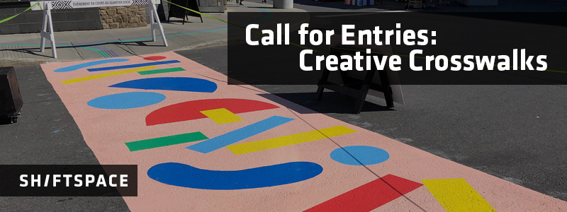 Image: A photo of a painted crosswalk featuring bright, geometrical shapes on a pink background. Text overlay: 