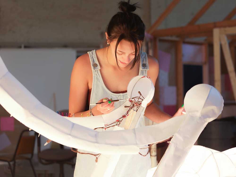 ADCI student Mary Alexis Wirths works on Debeb, a large-scale illuminated sculpture, in the class Jump!Star Sculpture & Ritual