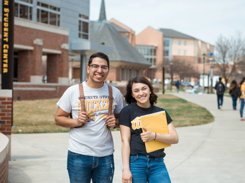 Two students walking to class.