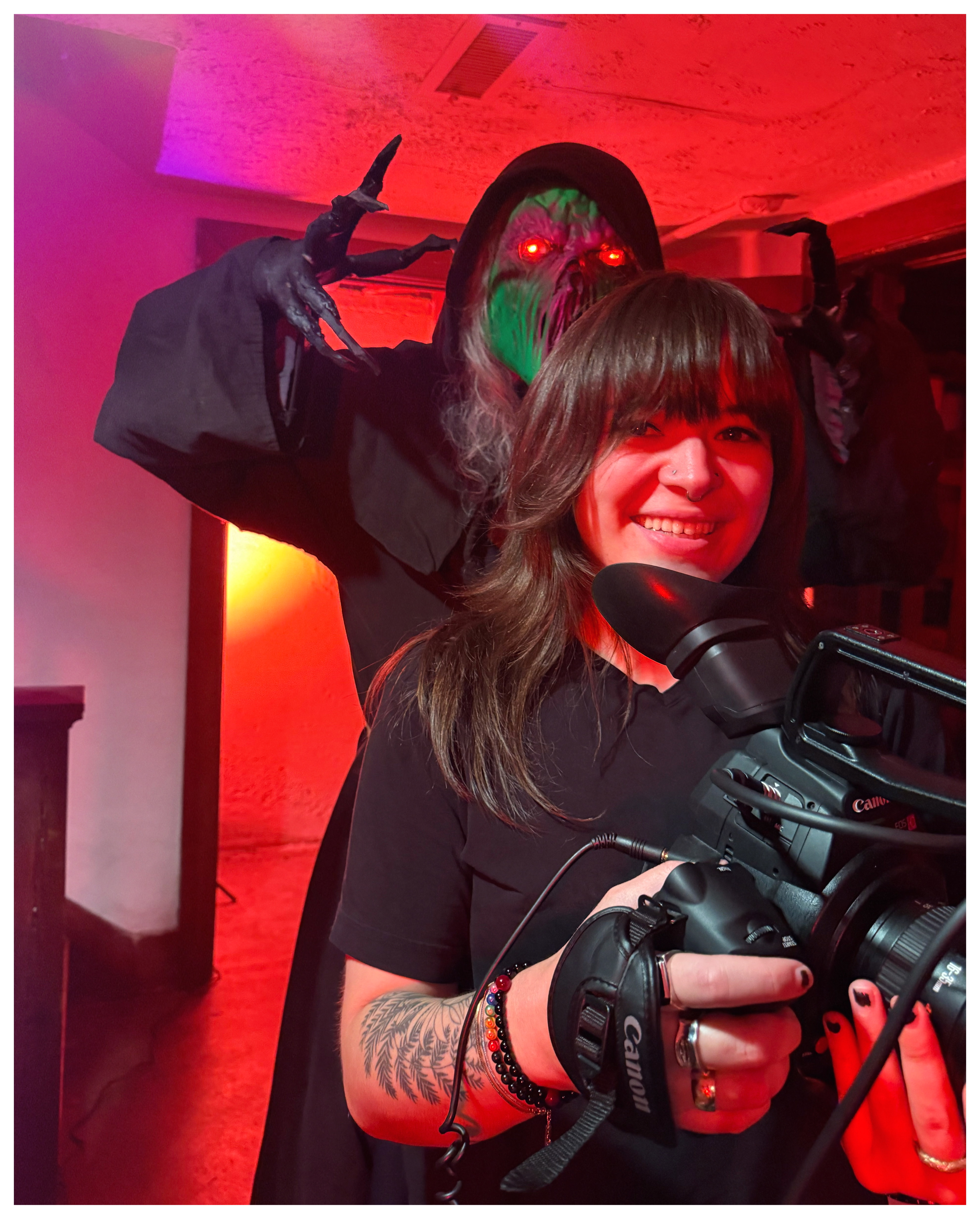 Filmmaking alumni, McKenzey Bell in holding a camera.