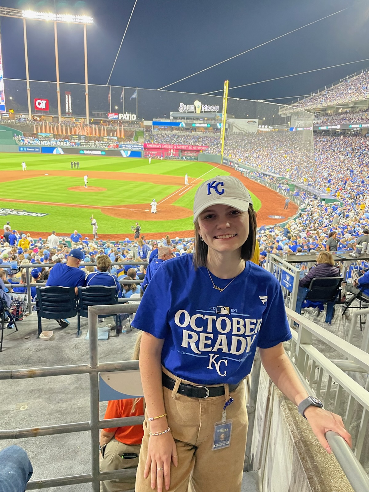 Lainey in a baseball jersey at a game.