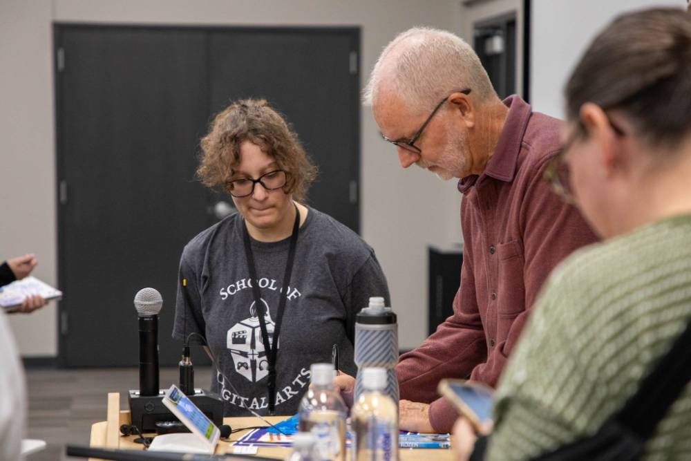 Animation student getting a signature from Chris Buck.