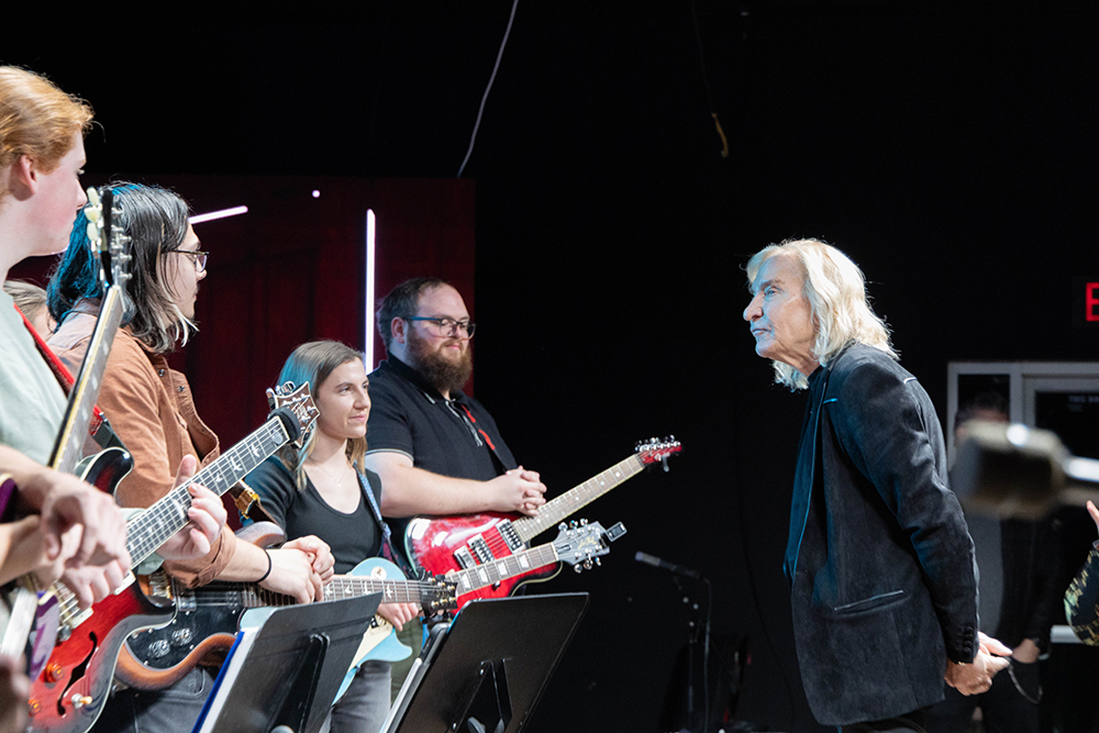 Joe Walsk talking to students.