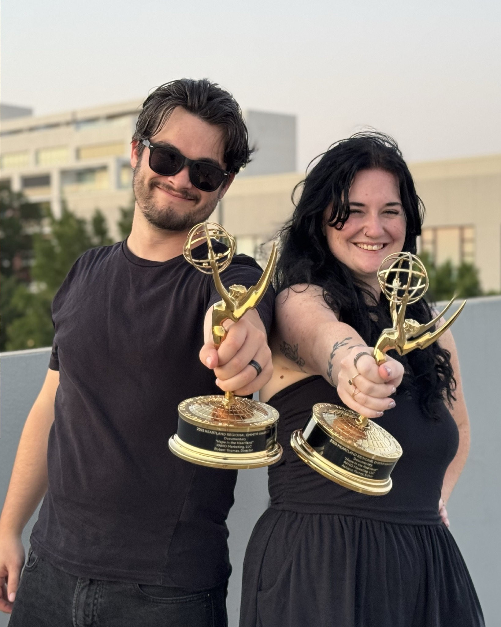 Robert Thomas with Ashlynn Farney holding their Regional Emmys.
