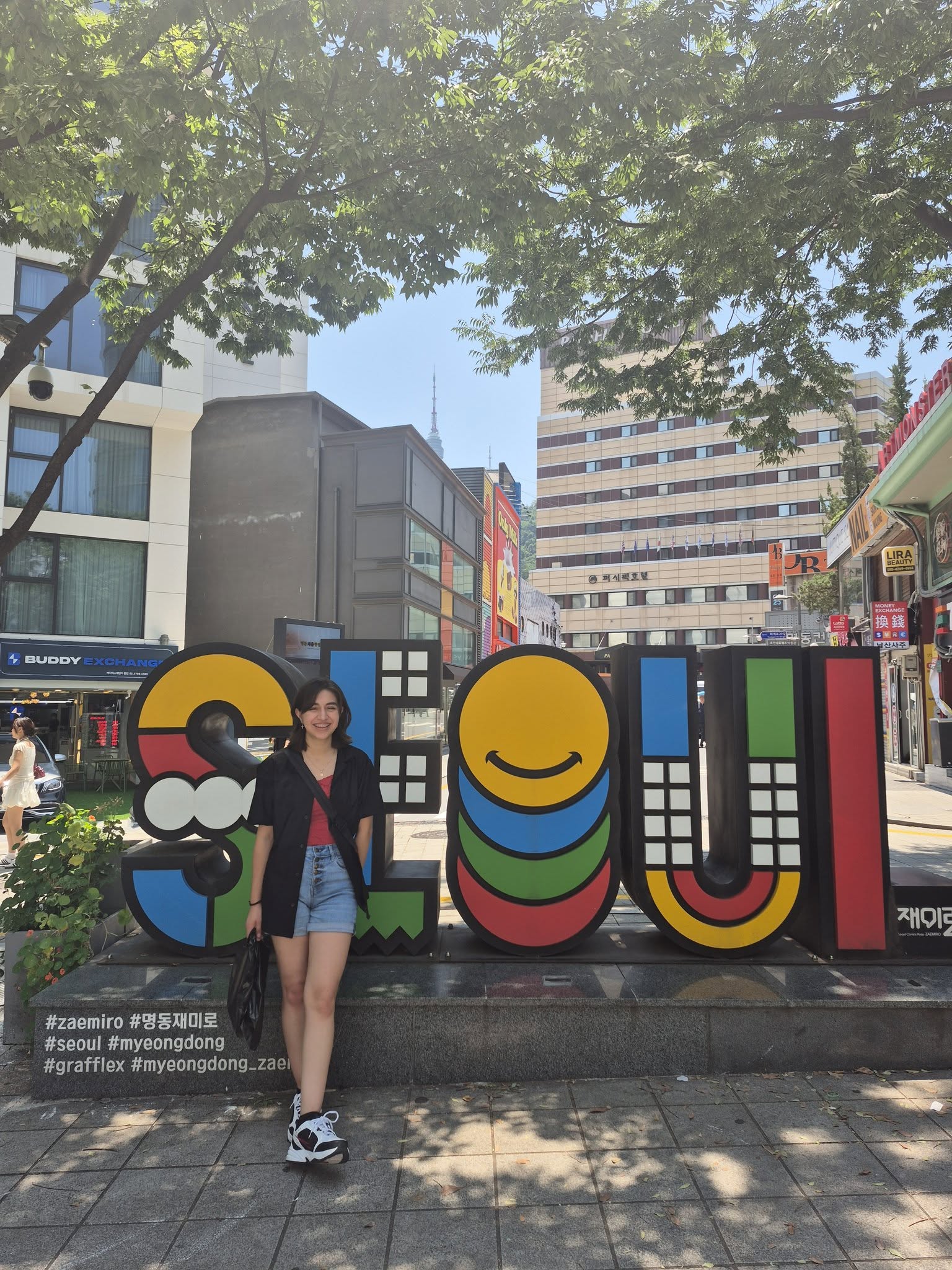 Yasmin Plascencia in front of a Seoul sign.