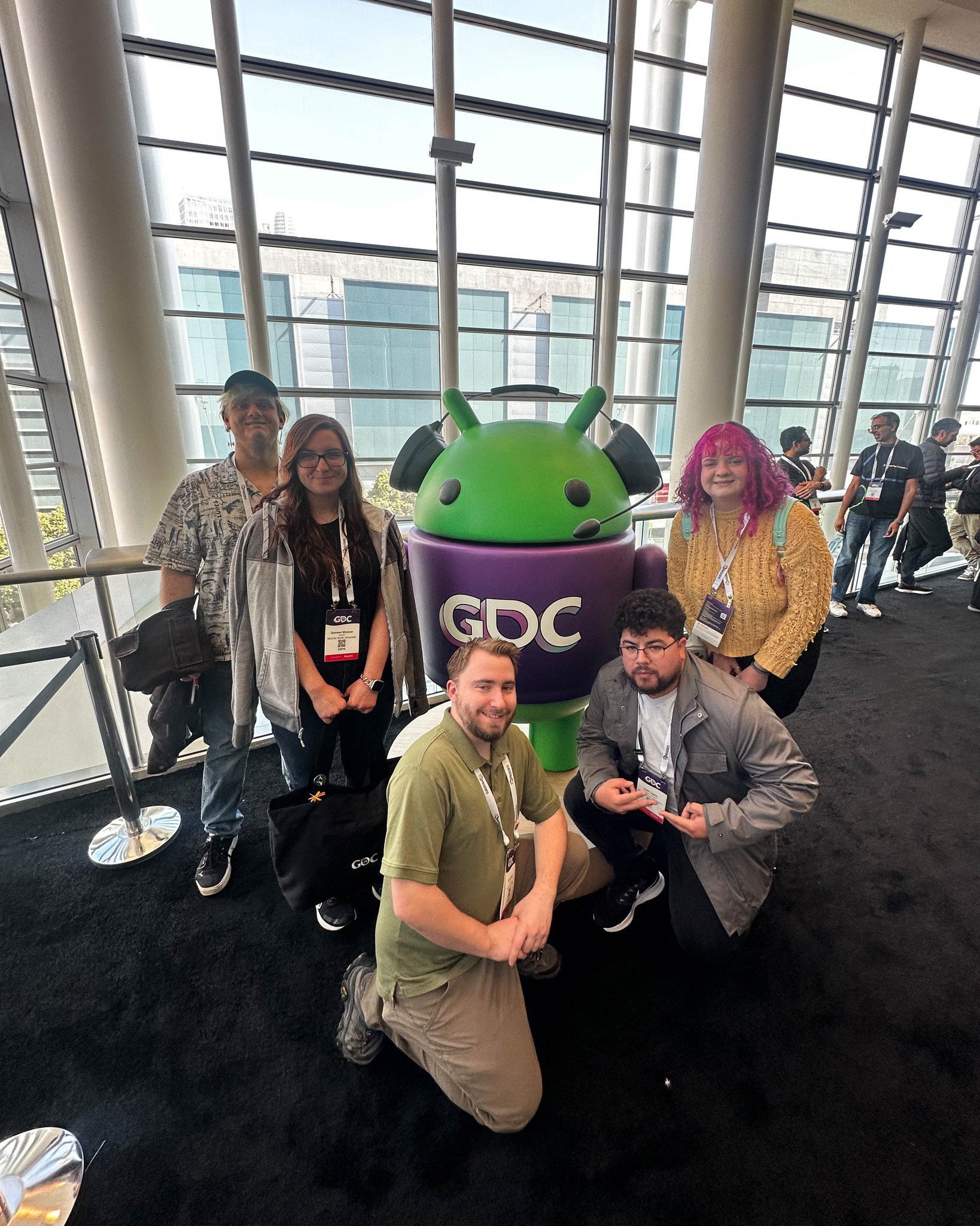 School of Digital Arts students with the GDC mascot.