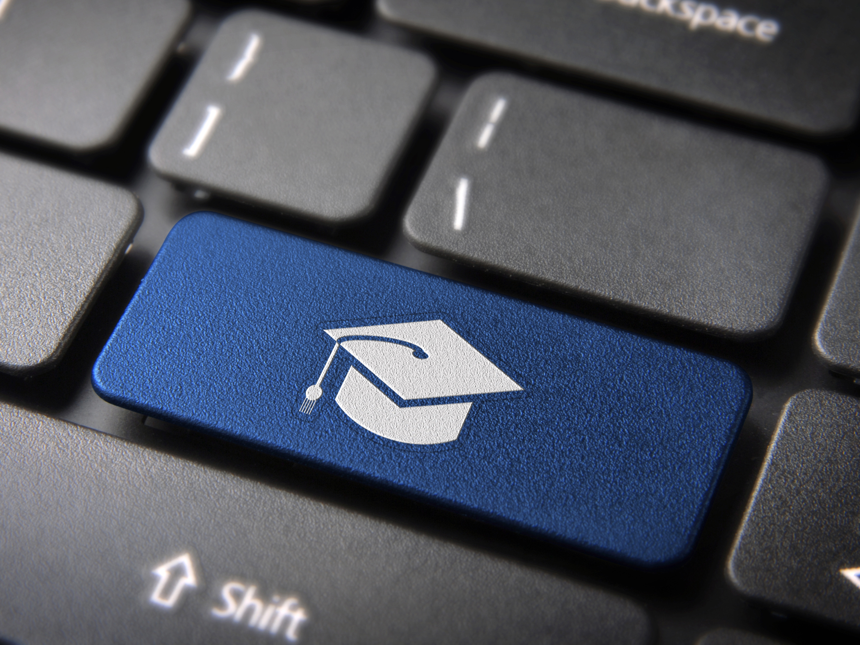 Computer keyboard with a graduation cap key